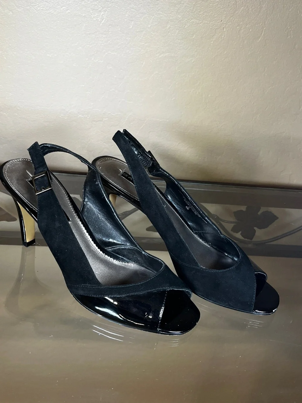 Open toed black leather heels